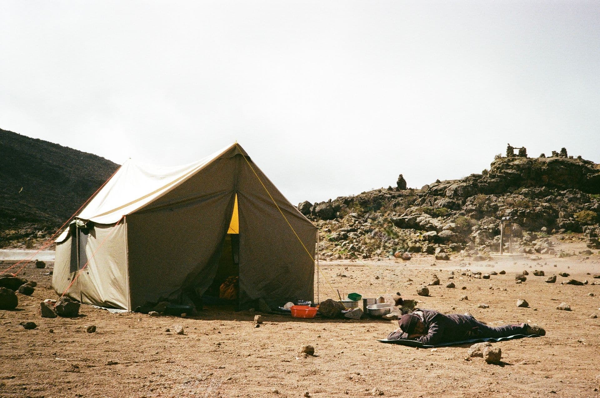 Camp pitched at the foot of high country