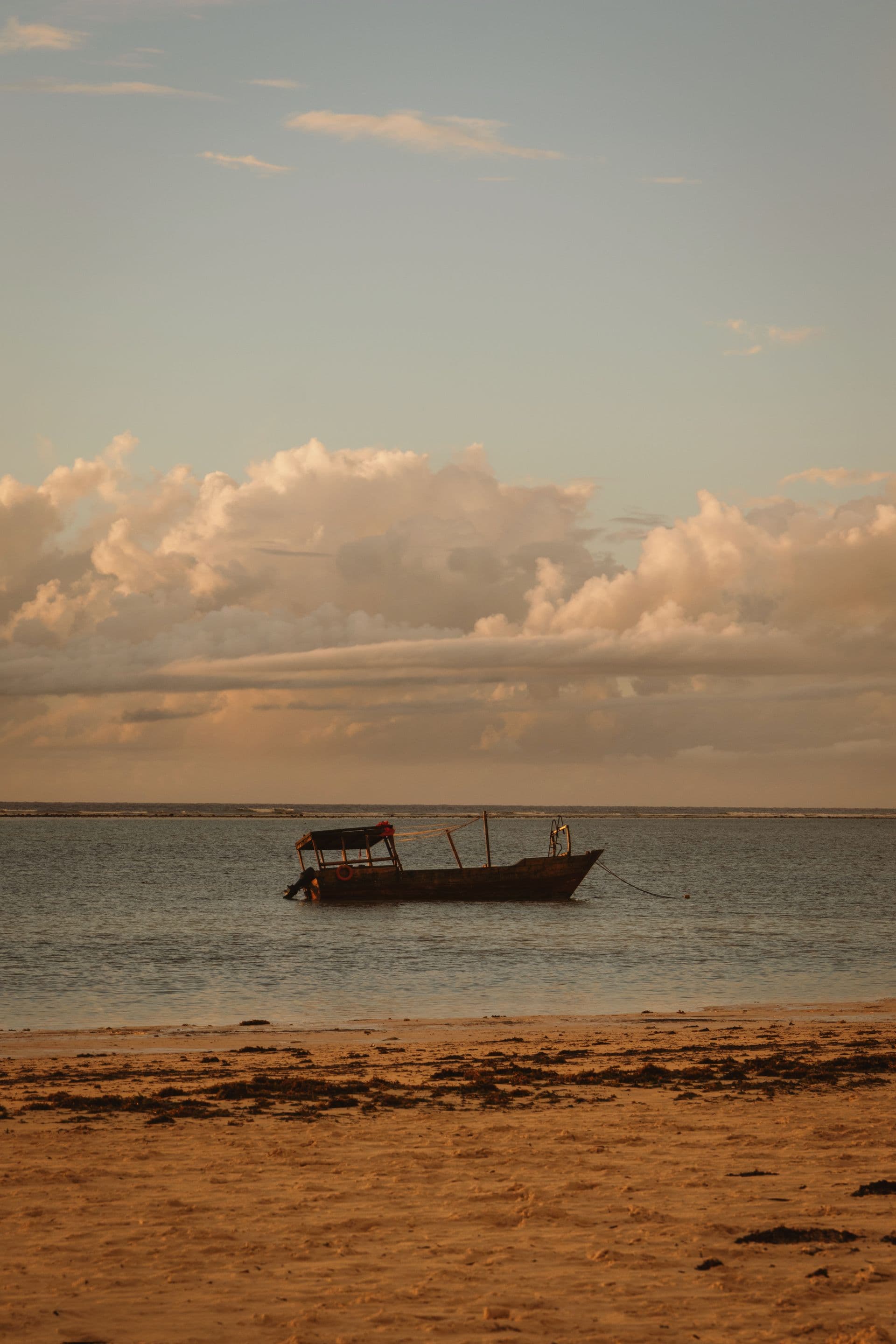 Dhow sailing at sunset off Zanzibar